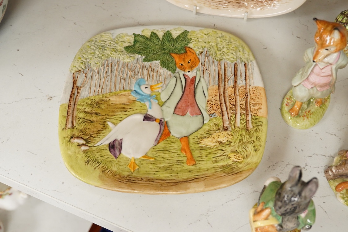 A collection of Beswick and Royal Albert Beatrix Potter figures to include Little Black Rabbit and The Head Gardener, together with two plates, 19cm wide